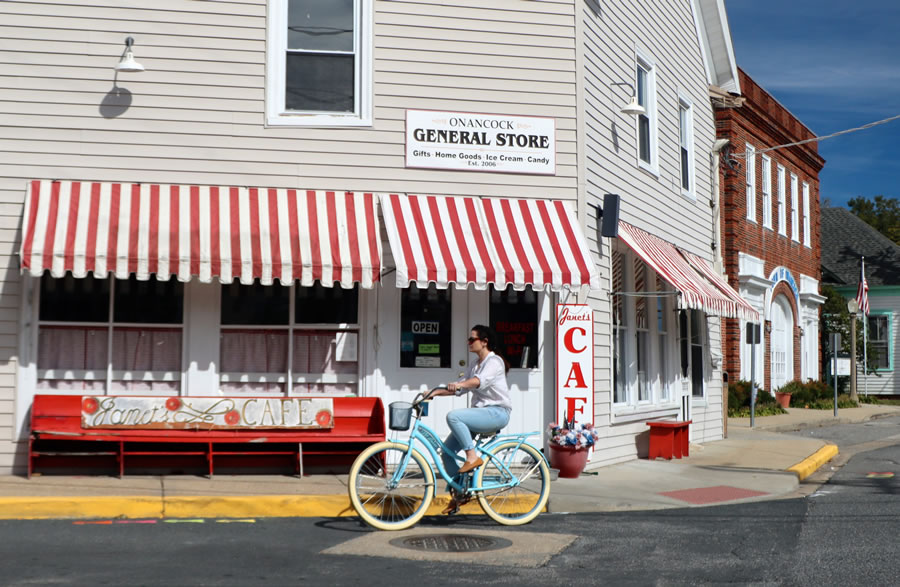 A woman riding a bike in Onancock, Virginia