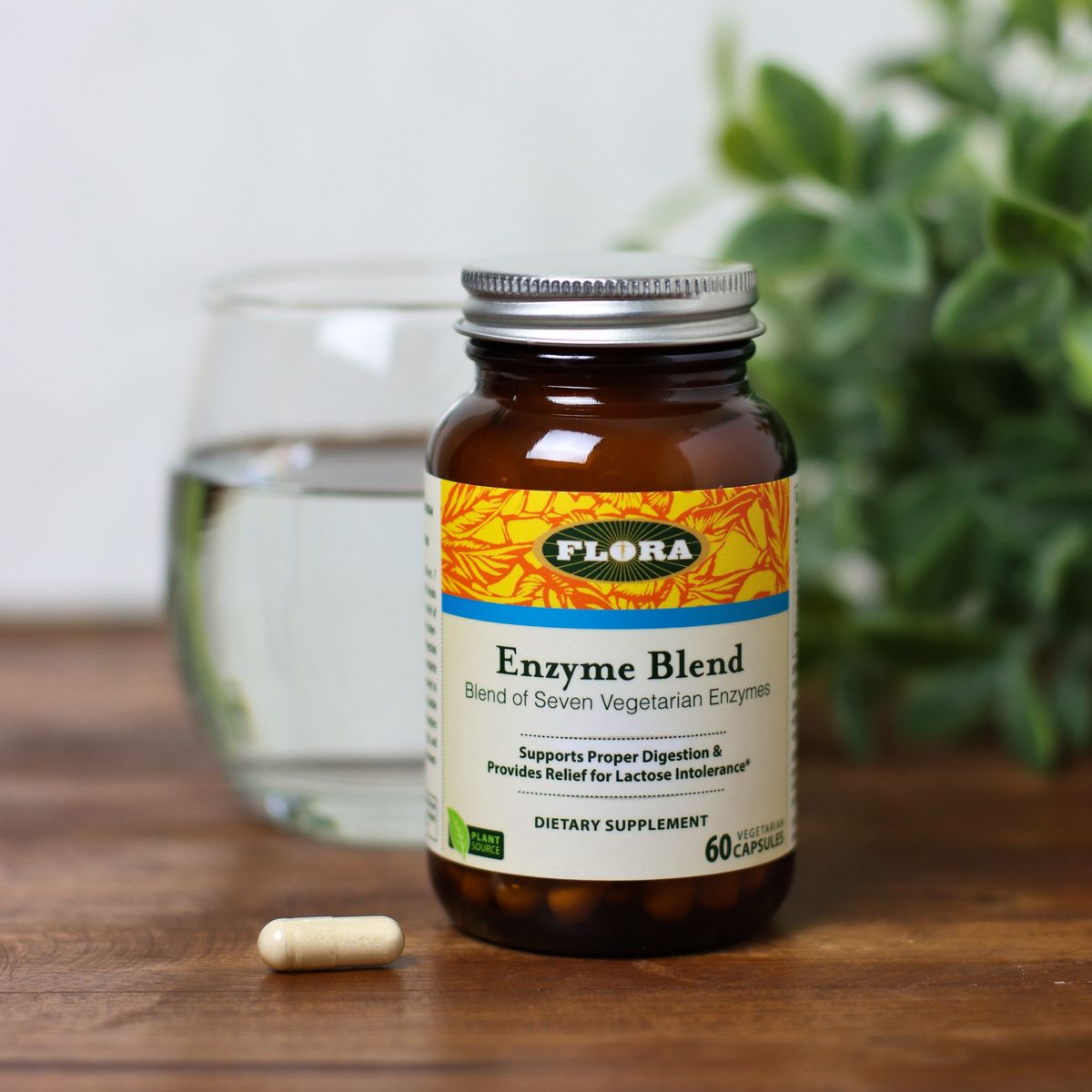 A bottle and capsule of Enzyme Blend from Flora